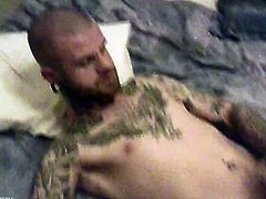 Tattoeed stud with random piercing on his body getting horny as he took his huge dick stroke it and jacking it off til he releases her fresh hot load right on his body.