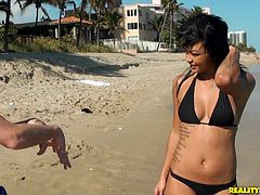 Sexy ebony chick Harley Dean, wearing a bikini, is having fun with a man on a beach. After that they go to a bedroom and fuck in the reverse cowgirl position and doggy style there.