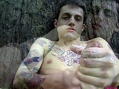 Homo Emo brings you a hell of a free porn video where you can see how the tattooed twink Chris Porter masturbates and poses under a tree for your enjoyment.