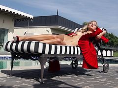 What are you waiting for? Watch this blonde beauty, with natural boobs wearing red clothes, while she moves erotically outdoors in a reality clip.