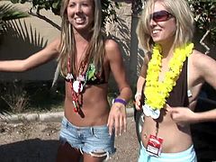 A reality video with three naughty teens having fun. The girls walk around the cameraman and drink beer.