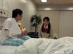 This beautiful Asian teen pays this lucky guy a visit at the hospital and gives him a hot handjob before she gets on top of him to ride his hard cock.