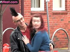 Red haired amateur chick seducing her punk boyfriend by caressing his huge dick outdoors. They started petting at their backyard and fuck passionately at their home.