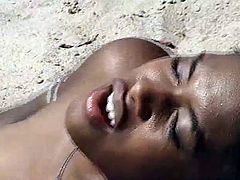 Horny black couple spotted fucking by the beach in this hot tube video.