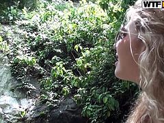 This cute blonde chick is ready to do some exploring. She heads down the hiking path and arrives at a nice river. Her guide is checking out her long sexy legs as he follows behind her. He helps her collect plant samples. will they bang in the jungle?