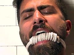 Enjoy our manly, bearded gays. Oh yeah, these two dudes are hot as hell and further more, they are in the shower, having some real men fun! One of them is all tied up and the other is fucking horny, so horny that he doesn't takes his time at all and begins to sucks his dick immediately and then finger his ass