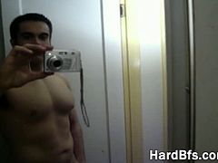 Handsome guy takes his clothes off and poses naked in front of webcam