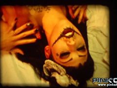 This kinky goth babes are wearing a voodoo makeup and looking scary, and sexy. The black chick grinds against her lover, kisses her deeply and eats her pussy. What other kinky action will these sluts get into? They have fun with a big dildo.