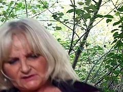 Old horny granny get fucked hard by young cock outdoor.