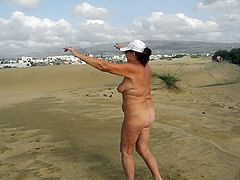 Old whore doing exercises in the dunes