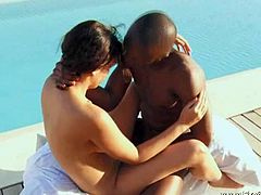 This African couple starts to fuck indoors, but then they go in their backyard and continue the fun by the pool. He bangs her pussy in a really erotic way.
