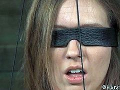 Blind folded and tied up brunette suspended by nipples is ready for tortures