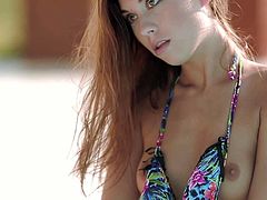 Long haired cute bikini girl Sabrisse with slim figure shows her naughty bits by the pool. She bares her sexy small tits and then demonstrates her beautifully shaved young pussy.