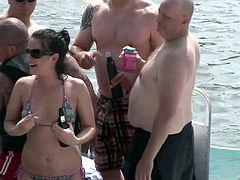 Bikini party girls on a boat flash their tits and kiss for the guys
