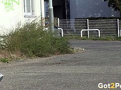 Dirty black haired chick pisses near road sign a lot