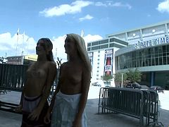 Lewd lesbian duo flashing their nice tits in the parking lot