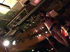 Sweet dark haired sex doll presents hot pole dance in the night club