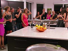 The couples are in the kitchen and talking about all the great sex, they will be having. After enjoying some champagne, they head to the living room and the fucking begins. This hot chick opens up her legs and gets eaten out, while everyone watches.
