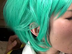 Chizue is horny and being touched by two guys in the same time, makes her extremely excited. The men are also turned on, especially when they get to squeeze her lovely boobs. See this provocative Asian bitch with green-dyed hair, sucking dicks on knees.