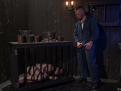 It's time for this caged slave to be fed and what do you think he is going to have to eat? He will be eating cum, of course. The master shoves his big dick into the slaves mouth and makes him give a blowjob. He has to swallow all of that sperm.