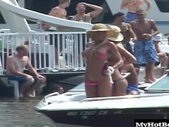 You have a whole group of slutty, horny and fun loving amateurs going down to the dock today. They all seem to have malfunctioning bikinis, judging by the number of tits that come out.