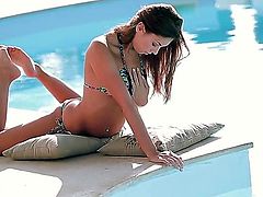 Skinny girl Sabrisse with long hair and slim legs takes off her bikini top and shows her natural pretty small tits beside the pool. Then she gets completely naked to show her pussy.