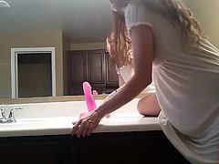 Cute girl riding dildo in front of mirror