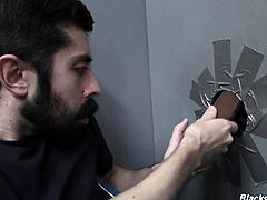 White man sucks and fucks a black cock at a gloryhole