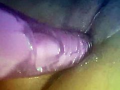 Babe plays with purple vibrator