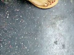 Candid ebony feet with red toes
