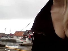 Norwegian slut shows off her huge breasts in public