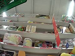 Upskirt with cute ass in toy shop