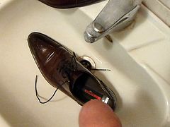 Piss in men's dress shoe