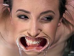 A stud was hired to brutally punish Casey Calvert, who cheated her husband. The executor tortured her pussy, by spreading the vertical lips really wide and placed a vibrator on clit. He restrained and slapped her, inserted a dildo in tiny asshole, and didn't allow her to reach an orgasm.
