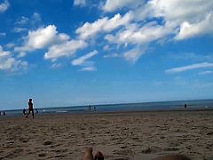 2 women in full-frontal nudity on the beach