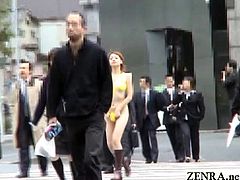 JAV insane public exposure featuring a pale and rail thin model stark naked in a DVD store who changes into a very revealing thong bikini before walking around outside in Tokyo with English subtitles