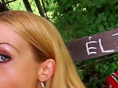 Blonde-haired Russian hottie Isabella Clark dressed in red has great outdoor sex in the park. She sucks stiff cock beside a bench and then gets her tight pink hole penetrated from behind.