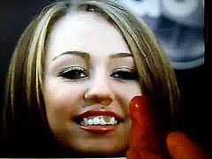 Miley Cyrus smiles for cum