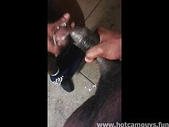 Two black guys jerks off in public and cums on each other's cock.