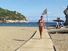 Hot beach babe in micro bikini
