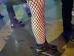 Girl in fishnet pantyhose with boots