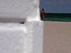 Depraved leaves a girl with her tits out on the beach