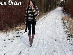 Sexy brunette wears Fur outdoors