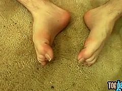 York Reid shows his feet while stroking his hairy schlong