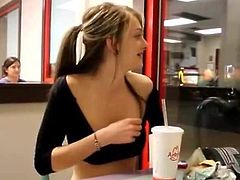 Busty teen show her tits in a McDonald