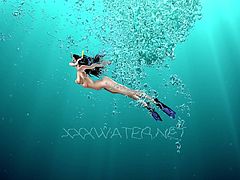 Yummy babe Irina Russaka is stripping under the water