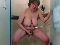 Watch this GILF get off in the shower