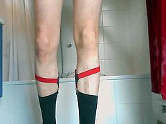 Cumming in patterned black goldtoe socks with red garters