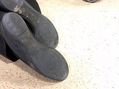 Shoe Fetish - Ultra Close-Up of Shopworker's Dirty Shoes