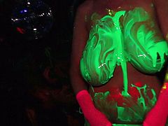 Kelly Madison covered in paint while playing with her body